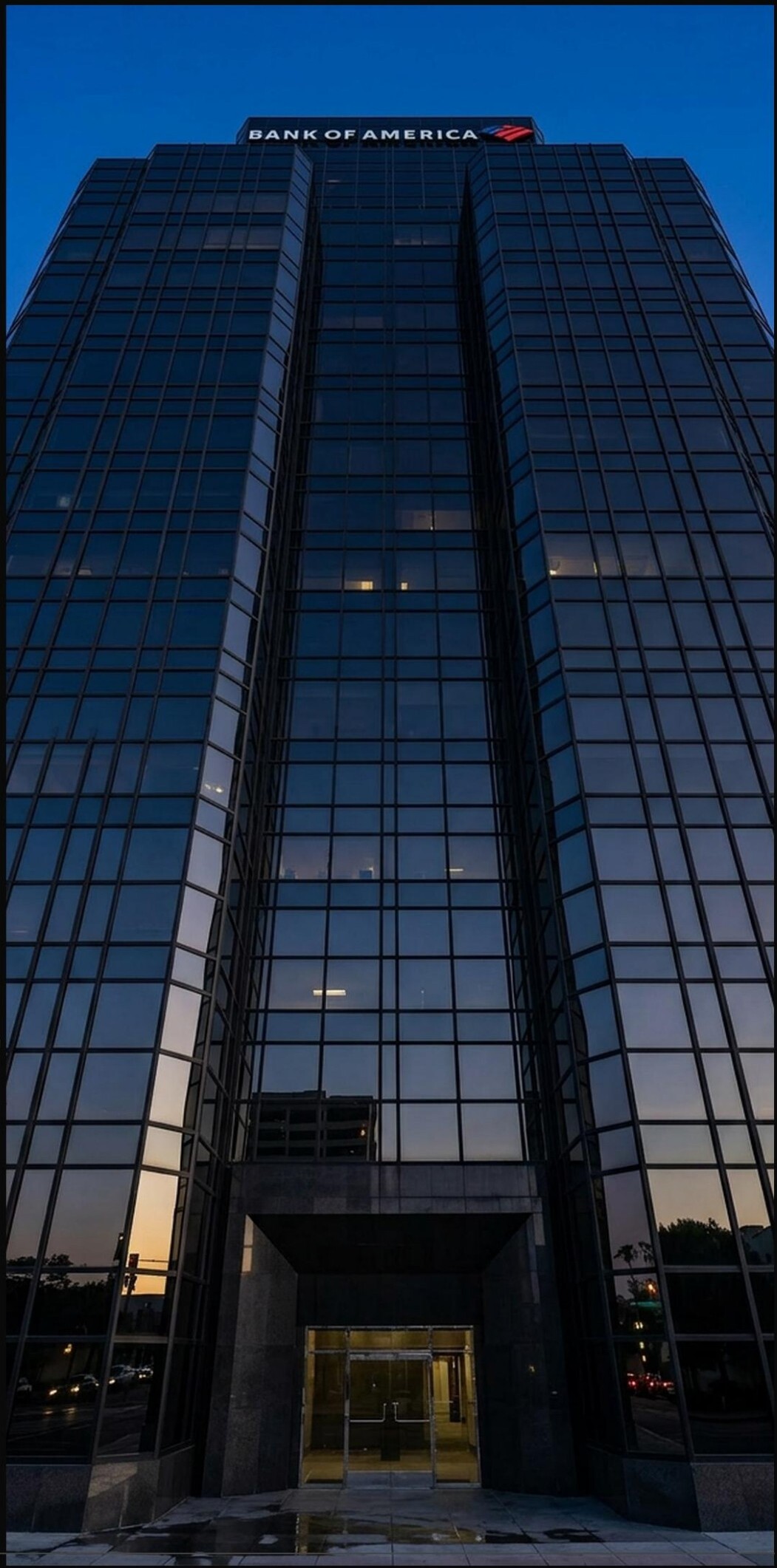 Bank of America Tower exterior, looking up the facade at twilight